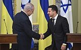 Prime Minister Benjamin Netanyahu (L) shakes hands with Ukrainian President Volodymyr Zelensky during a joint press conference in the Ukrainian capital Kyiv, on August 19, 2019. (Sergei Supinsky/AFP)
