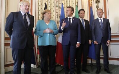 (L-R) Britain's Prime Minister Boris Johnson, German Chancellor Angela Merkel, French President Emmanuel Macron, Italian Premier Giuseppe Conte and President of the European Council Donald Tusk pose during a G7 coordination meeting with the Group of Seven European members at the Hotel du Palais in Biarritz, southwestern France on August 24, 2019. (Markus Schreiber/POOL/AFP)