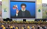 Hezbollah supporters watch a televised speech by the Lebanese terror group's leader Hassan Nasrallah, in the town of Al-Ain in Lebanon's Bekaa valley, on August 25, 2019. (AFP)