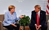 German Chancellor Angela Merkel, left, and US President Donald Trump speak during a bilateral meeting on the third day of the annual G7 Summit in Biarritz, south-west France, August 26, 2019. (Nicholas Kamm/AFP)