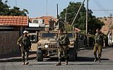 Illustrative: Israeli soldiers patrolling near the northern Israeli town of Avivim, close to the border with Lebanon, August 26, 2019. (Jalaa Marey/AFP)