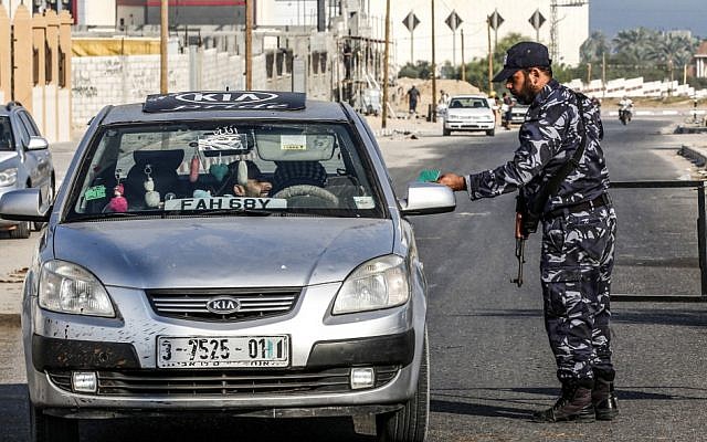 Hamas security forces stop a vehicle at a checkpoint in Khan Younis in the southern Gaza Strip on August 28, 2019 (Said Khatib/AFP) Hamas security forces stop a vehicle at a checkpoint in Khan Younis in the southern Gaza Strip on August 28, 2019 (Said Khatib/AFP)