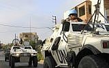 Soldiers of the United Nations Interim Forces in Lebanon (UNIFIL) patrol a road in the southern Lebanese village of Kfar Kila along the border with Israel on August 29, 2019. (Mahmoud ZAYYAT / AFP)
