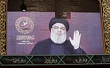 A speech by Hezbollah chief Hassan Nasrallah is transmitted on a large screen in Beirut's southern suburbs on August 31, 2019. (Anwar Amro/AFP)