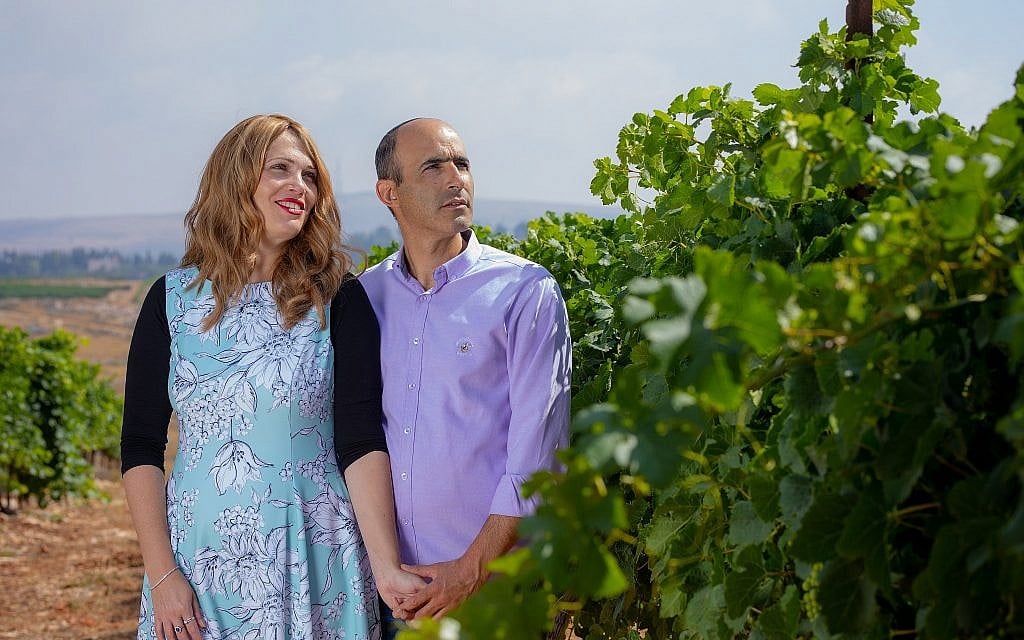 Vered and Erez Ben Sa’adon in a vineyard of Tura Winery, which they founded in 2003 in the West Bank settlement of Rechelim (courtesy Tura Winery) Vered and Erez Ben Sa’adon in a vineyard of Tura Winery, which they founded in 2003 in the West Bank settlement of Rechelim (courtesy Tura Winery)