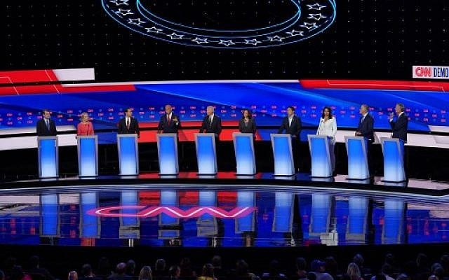 Democratic presidential candidate Sen. Cory Booker (D-NJ) (4th L) speaks while Sen. Michael Bennet (D-CO) (L-R), Sen. Kirsten Gillibrand (D-NY), former housing secretary Julian Castro, former Vice President Joe Biden, Sen. Kamala Harris (D-CA) , former tech executive Andrew Yang, Rep. Tulsi Gabbard (D-HI), Washington Gov. Jay Inslee, and New York City Mayor Bill De Blasio listen during Democratic Presidential Debate at the Fox Theatre July 31, 2019 in Detroit, Michigan. (Scott Olson/Getty Images/AFP) Democratic presidential candidate Sen. Cory Booker (D-NJ) (4th L) speaks while Sen. Michael Bennet (D-CO) (L-R), Sen. Kirsten Gillibrand (D-NY), former housing secretary Julian Castro, former Vice President Joe Biden, Sen. Kamala Harris (D-CA) , former tech executive Andrew Yang, Rep. Tulsi Gabbard (D-HI), Washington Gov. Jay Inslee, and New York City Mayor Bill De Blasio listen during Democratic Presidential Debate at the Fox Theatre July 31, 2019 in Detroit, Michigan. (Scott Olson/Getty Images/AFP)