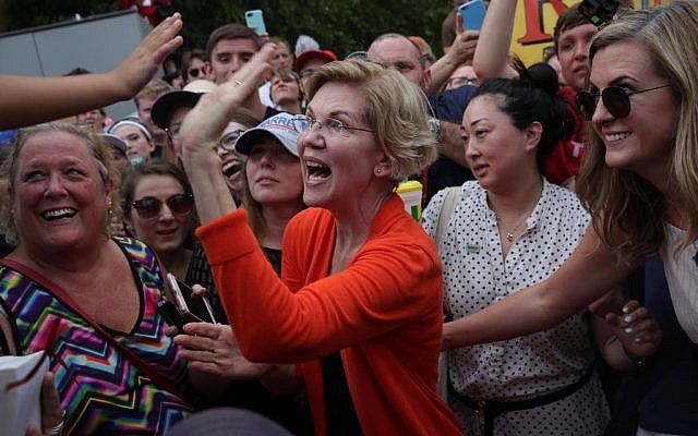 Democratic presidential candidate U.S. Sen. Elizabeth Warren (D-MA) greets a supporter after she delivered a campaign speech at the Des Moines Register Political Soapbox at the Iowa State Fair on August 10, 2019 in Des Moines, Iowa. (Alex Wong/Getty Images/AFP) Democratic presidential candidate U.S. Sen. Elizabeth Warren (D-MA) greets a supporter after she delivered a campaign speech at the Des Moines Register Political Soapbox at the Iowa State Fair on August 10, 2019 in Des Moines, Iowa. (Alex Wong/Getty Images/AFP)