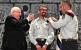Ala Abu Rokun (center) receives his new brigadier general insignia from President Reuven Rivlin (left) and IDF chief Aviv Kohavi (right) during a ceremony at the President's Residence, on August 14, 2019 (Mark Neiman/GPO)