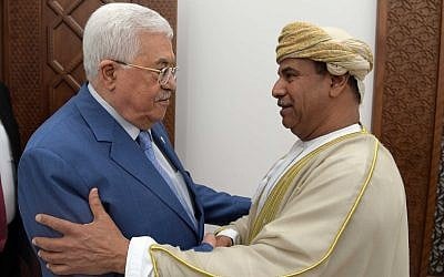 Palestinian Authority President Mahmoud Abbas and Omani Ambassador to Jordan Khamis bin Mohammed al-Faris embracing each other in Ramallah on August 6, 2019. (Credit: Wafa)