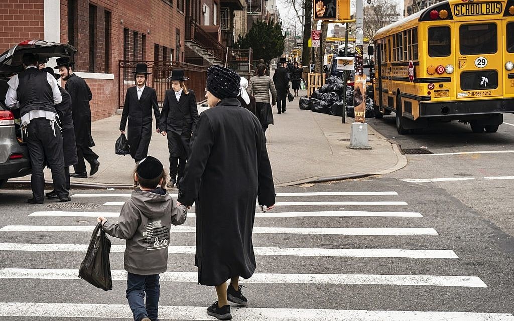 Pedestrians walk past a yeshiva in the South Williamsburg neighborhood of Brooklyn, April 9, 2019. (Drew Angerer/Getty Images via JTA) Pedestrians walk past a yeshiva in the South Williamsburg neighborhood of Brooklyn, April 9, 2019. (Drew Angerer/Getty Images via JTA)