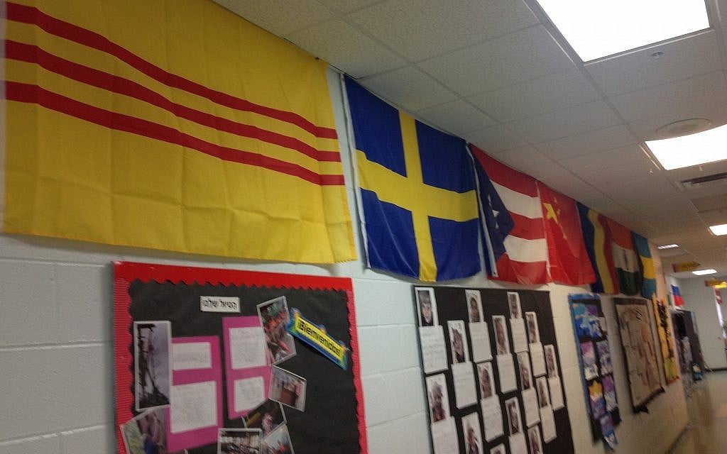 Hershorin Schiff Community Day School in Sarasota, Florida has a hallway of flags representing the 40 countries its students' families hail from. (Ben Sales/JTA)