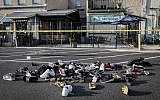 Shoes are piled outside the scene of a mass shooting including Ned Peppers bar on August 4, 2019, in Dayton, Ohio. (AP/John Minchillo)