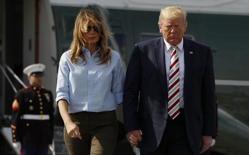 US President Donald Trump, with first lady Melania Trump, walks towards the media before speaking in Morristown, N.J., August 4, 2019. (AP Photo/Jacquelyn Martin) US President Donald Trump, with first lady Melania Trump, walks towards the media before speaking in Morristown, N.J., August 4, 2019. (AP Photo/Jacquelyn Martin)