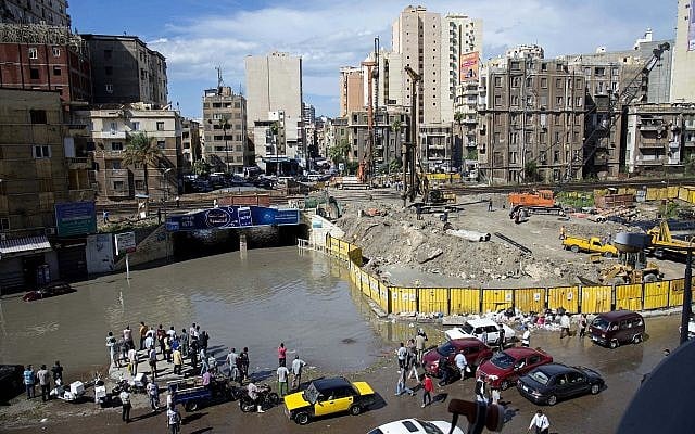 Egyptians check floodwaters after a heavy rainfall in the coastal city of Alexandria, Egypt, October 25, 2015. (Heba Khamis/AP)