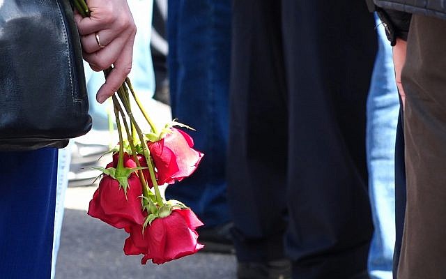 A woman holds roses as she and others gather for the funerals of five Russian nuclear engineers killed by a rocket explosion in Sarov, the closed city located 370 kilometers (230 miles) east of Moscow, which has served as a base for Russia's nuclear weapons program since the late 1940s, on August 12, 2019. (Screenshot taken from footage provided by the Russian State Atomic Energy Corporation ROSATOM press service via AP) A woman holds roses as she and others gather for the funerals of five Russian nuclear engineers killed by a rocket explosion in Sarov, the closed city located 370 kilometers (230 miles) east of Moscow, which has served as a base for Russia's nuclear weapons program since the late 1940s, on August 12, 2019. (Screenshot taken from footage provided by the Russian State Atomic Energy Corporation ROSATOM press service via AP)