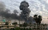 In this photo from August 12, 2019, plumes of smoke rise after an explosion at a military base southwest of Baghdad, Iraq. (AP Photo/Loay Hameed)