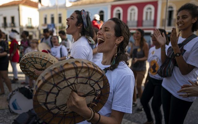 Protesters sing and play drums during a march against the Brazilian government's environmental policies, on the sidelines of a climate change meeting in Salvador, Brazil, August 21, 2019. (AP Photo/Victor R. Caivano) Protesters sing and play drums during a march against the Brazilian government's environmental policies, on the sidelines of a climate change meeting in Salvador, Brazil, August 21, 2019. (AP Photo/Victor R. Caivano)