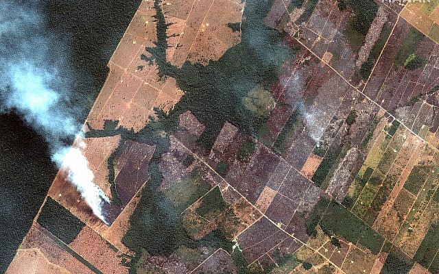 This August 15, 2019 satellite image from Maxar Technologies shows a fire and cleared land southwest of Porto Velho, Brazil. (Satellite image ©2019 Maxar Technologies via AP) This August 15, 2019 satellite image from Maxar Technologies shows a fire and cleared land southwest of Porto Velho, Brazil. (Satellite image ©2019 Maxar Technologies via AP)