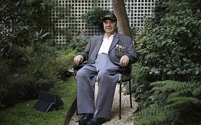 Gregory J. Melikian, a 20-year old Sergeant working in SHAEF headquarters of Supreme Commander General Dwight D. Eisenhower in 1944 and 1945, and a witness in the surrender of the high German Authorities in Reims, France, poses during an interview with the Associated Press on August 23, 2019 in Paris. (AP/Daniel Cole)