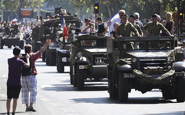 People dressed in World War II era clothes take part in the celebrations of the liberation of Paris from Nazi occupation 75 years ago, in Paris, August 25, 2019. (AP Photo/David Vincent) People dressed in World War II era clothes take part in the celebrations of the liberation of Paris from Nazi occupation 75 years ago, in Paris, August 25, 2019. (AP Photo/David Vincent)
