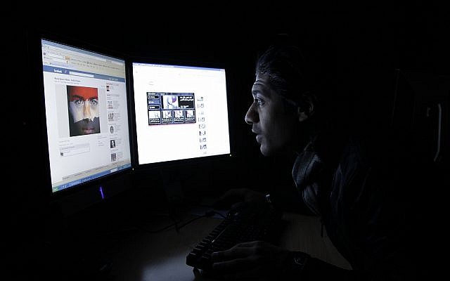 Illustrative: A Saudi man looking at Facebook at his Riyadh office on Thursday, Feb. 10, 2011. (AP/Hassan Ammar) Illustrative: A Saudi man looking at Facebook at his Riyadh office on Thursday, Feb. 10, 2011. (AP/Hassan Ammar)
