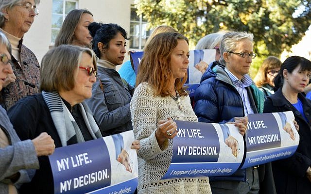 Illustrative: In this October 26, 2015, file photo, right to die advocates rally outside the New Mexico Supreme Court in Santa Fe, New Mexico, after a lawyer asked justices to allow terminally-ill patients to end their lives. (AP Photo/Russell Contreras, File) Illustrative: In this October 26, 2015, file photo, right to die advocates rally outside the New Mexico Supreme Court in Santa Fe, New Mexico, after a lawyer asked justices to allow terminally-ill patients to end their lives. (AP Photo/Russell Contreras, File)