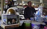 A piggy bank with a photo of Hezbollah leader Sayyed Hassan Nasrallah is displayed to collect money for the group in the southern Lebanese village of Kfar Rumman, Lebanon on January 21, 2016. (AP/Bilal Hussein)