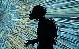 Illustrative: A visitor interacts with a display through a virtual reality goggles at the Saatchi Gallery in London, on Sunday, December 23, 2018. (AP Photo/Raphael Satter)