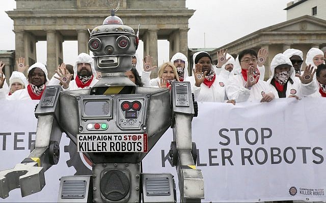People take part in a 'Stop killer robots' campaign at Brandenburg gate in Berlin, Germany, Thursday, March 21, 2019. (Wolfgang Kumm/dpa via AP) People take part in a 'Stop killer robots' campaign at Brandenburg gate in Berlin, Germany, Thursday, March 21, 2019. (Wolfgang Kumm/dpa via AP)