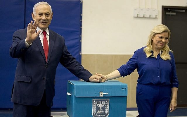 Prime Minister Benjamin Netanyahu, left, waves with his wife Sara after voting during parliamentary elections in Jerusalem on April 9, 2019. (AP/Ariel Schalit, Pool) Prime Minister Benjamin Netanyahu, left, waves with his wife Sara after voting during parliamentary elections in Jerusalem on April 9, 2019. (AP/Ariel Schalit, Pool)