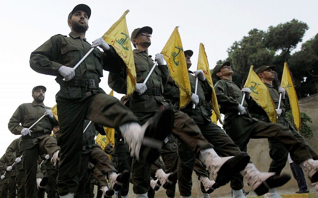 Hezbollah fighters parade during the inauguration of a new cemetery for their fighters who died fighting against Israel, in a southern suburb of Beirut, Lebanon, on November 12, 2010. (AP Photo/Hussein Malla, File) Hezbollah fighters parade during the inauguration of a new cemetery for their fighters who died fighting against Israel, in a southern suburb of Beirut, Lebanon, on November 12, 2010. (AP Photo/Hussein Malla, File)