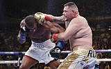 Andy Ruiz, right, punches Anthony Joshua during the seventh round of a heavyweight championship boxing match, June 1, 2019, in New York. Ruiz won the bout. (AP Photo/Frank Franklin II)
