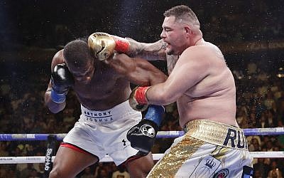 Andy Ruiz, right, punches Anthony Joshua during the seventh round of a heavyweight championship boxing match, June 1, 2019, in New York. Ruiz won the bout. (AP Photo/Frank Franklin II)