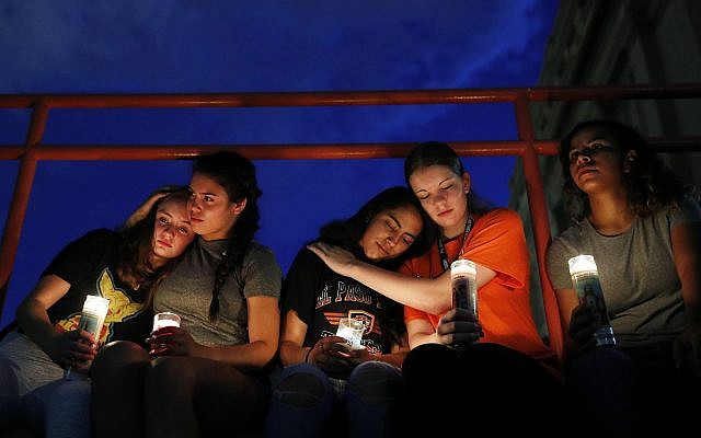 From left, Melody Stout, Hannah Payan, Aaliyah Alba, Sherie Gramlich and Laura Barrios comfort each other during a vigil for victims of the shooting August 3, 2019, in El Paso, Texas. (AP Photo/John Locher) From left, Melody Stout, Hannah Payan, Aaliyah Alba, Sherie Gramlich and Laura Barrios comfort each other during a vigil for victims of the shooting August 3, 2019, in El Paso, Texas. (AP Photo/John Locher)