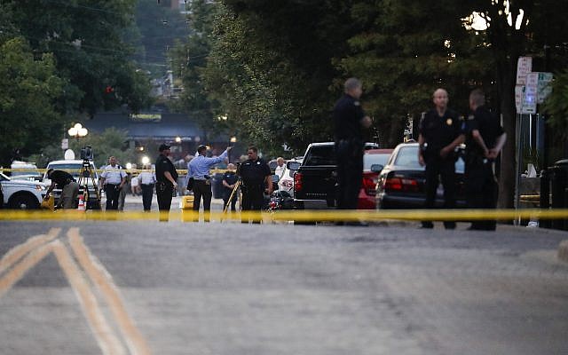 Authorities work the scene of a mass shooting, August 4, 2019, in Dayton, Ohio (AP Photo/John Minchillo) Authorities work the scene of a mass shooting, August 4, 2019, in Dayton, Ohio (AP Photo/John Minchillo)