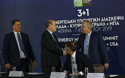 File: Greek Minister of Environment and Energy Kostas Hatzidakis, second left, shakes hands with Israel's Energy Minister Yuval Steinitz, right, as US Assistant Secretary of State for Energy Francis Fannon, second right, and Cyprus's Energy Minister Georgios Lakkotrypis , left, look on during a summit in Athens, August 7, 2019. (AP/Petros Giannakouris)