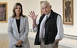 In this photo from September 19, 2014, retail mogul Leslie Wexner, right, and his wife Abigail tour the 'Transfigurations' exhibit at the Wexner Center for the Arts in Columbus, Ohio. (AP Photo/Jay LaPrete, File)
