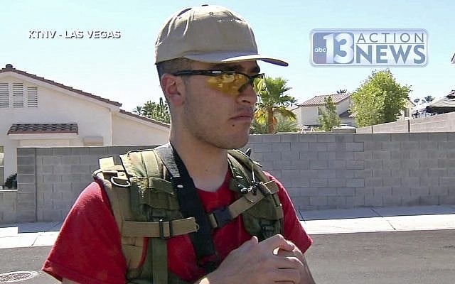 This Sept. 22, 2016, photo from video from KTNV 13 Action News shows Conor Climo during an interview while walking a Las Vegas neighborhood, heavily armed. (KTNV 13 Action News via AP) This Sept. 22, 2016, photo from video from KTNV 13 Action News shows Conor Climo during an interview while walking a Las Vegas neighborhood, heavily armed. (KTNV 13 Action News via AP)
