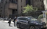 New York City medical examiner personnel leave their vehicle and walk to the Manhattan Correctional Center where financier Jeffrey Epstein died by suicide while awaiting trial on sex-trafficking charges, August 10, 2019, in New York. (AP/Bebeto Matthews)