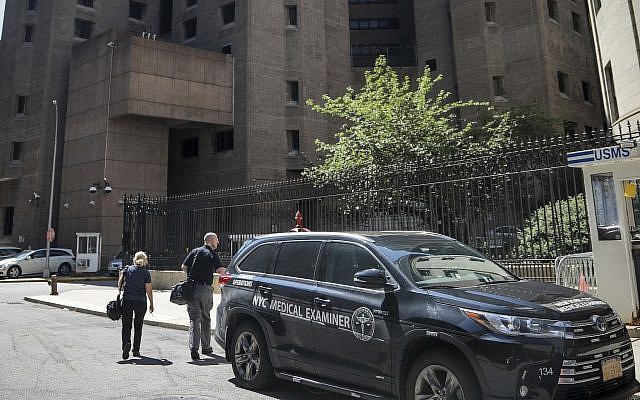 New York City medical examiner personnel leave their vehicle and walk to the Manhattan Correctional Center where financier Jeffrey Epstein died by suicide while awaiting trial on sex-trafficking charges, August 10, 2019, in New York. (AP/Bebeto Matthews) New York City medical examiner personnel leave their vehicle and walk to the Manhattan Correctional Center where financier Jeffrey Epstein died by suicide while awaiting trial on sex-trafficking charges, August 10, 2019, in New York. (AP/Bebeto Matthews)