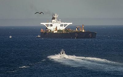 A supertanker hosting an Iranian flag is seen on the water in the British territory of Gibraltar, August 18, 2019. (AP Photo/ Marcos Moreno)