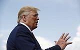 US President Donald Trump speaks with reporters before boarding Air Force One at Morristown Municipal Airport in Morristown, N.J., Sunday, Aug. 18, 2019. (AP Photo/Patrick Semansky)