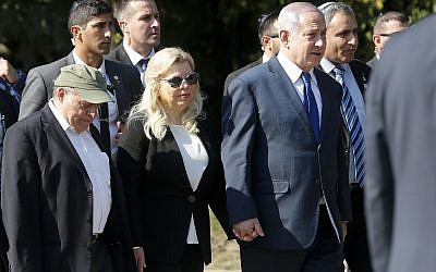 Israeli Prime Minister Benjamin Netanyahu, center right, and wife Sara, walk to visit a monument in Babi Yar ravine where Nazi troops machine-gunned many thousands of Jews during WWII, in Kyiv, Ukraine, on August 19, 2019.  (AP/Efrem Lukatsky)