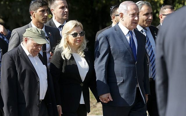 Israeli Prime Minister Benjamin Netanyahu, center right, and wife Sara, walk to visit a monument in Babi Yar ravine where Nazi troops machine-gunned many thousands of Jews during WWII, in Kyiv, Ukraine, on August 19, 2019. (AP/Efrem Lukatsky) Israeli Prime Minister Benjamin Netanyahu, center right, and wife Sara, walk to visit a monument in Babi Yar ravine where Nazi troops machine-gunned many thousands of Jews during WWII, in Kyiv, Ukraine, on August 19, 2019. (AP/Efrem Lukatsky)