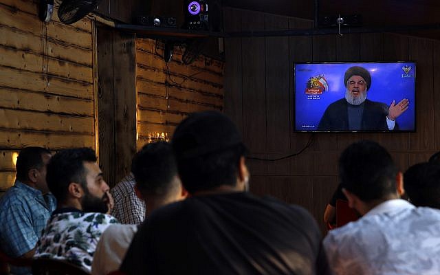 People listen to a speech by Hezbollah leader Sayyed Hassan Nasrallah being broadcast on Hezbollah's al-Manar TV channel, in a southern suburb of Beirut, Lebanon, Sunday Aug. 25, 2019. (AP/Bilal Hussein) People listen to a speech by Hezbollah leader Sayyed Hassan Nasrallah being broadcast on Hezbollah's al-Manar TV channel, in a southern suburb of Beirut, Lebanon, Sunday Aug. 25, 2019. (AP/Bilal Hussein)