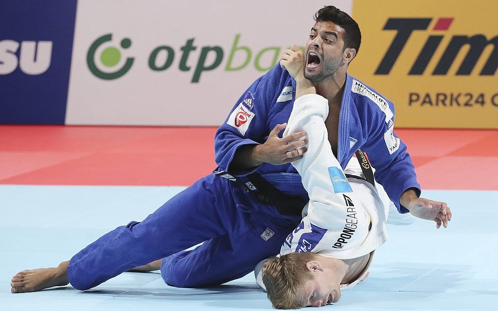 Sagi Muki of Israel, top, competes against Matthias Casse of Belgium during a men's -81 kilogram final of the World Judo Championships in Tokyo, Wednesday, Aug. 28, 2019. (AP Photo/Koji Sasahara)