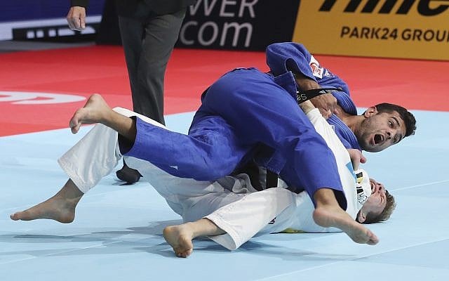 Sagi Muki of Israel, top, competes against Matthias Casse of Belgium during a men's -81 kilogram final of the World Judo Championships in Tokyo, Wednesday, Aug. 28, 2019. (AP Photo/Koji Sasahara) Sagi Muki of Israel, top, competes against Matthias Casse of Belgium during a men's -81 kilogram final of the World Judo Championships in Tokyo, Wednesday, Aug. 28, 2019. (AP Photo/Koji Sasahara)