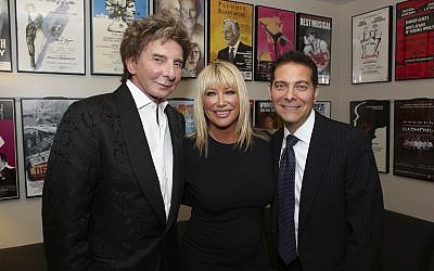 From left: Composer Barry Manilow, Music, actress Suzanne Somers and Michael Feinstein pose backstage after the opening night performance of "Harmony" at Center Theatre Group/Ahmanson Theatre on Wednesday, March 12, 2014, in Los Angeles, California (Ryan Miller/Invision/AP)