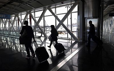 Illustrative: Travelers move through Logan International Airport in Boston January 28, 2015. (Elise Amendola/AP)