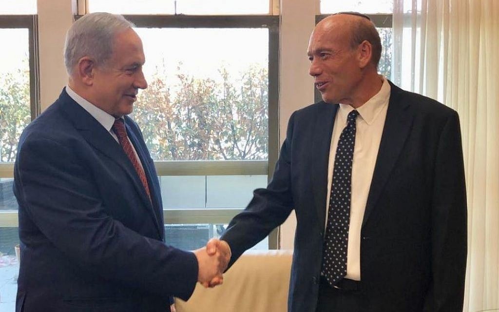 Matanyahu Englman (R) shakes hands with Prime Minister Benjamin Netanyahu at the Prime Minister's Office in Jerusalem shortly after being nominated for state comptroller on June 3, 2019. (PMO/Twitter) Matanyahu Englman (R) shakes hands with Prime Minister Benjamin Netanyahu at the Prime Minister's Office in Jerusalem shortly after being nominated for state comptroller on June 3, 2019. (PMO/Twitter)